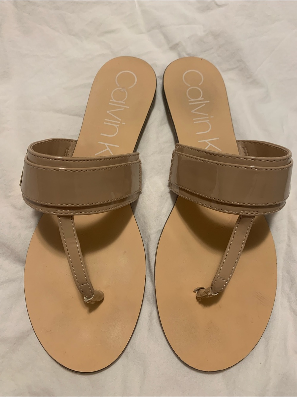 Calvin Klein Patent Nude-Tone Thong Slide Sandals